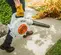 Gray and orange and black STIHL Hand-held Blower, Gas Powered