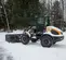 Orange and black Case Wheel Loader with a snow attachment